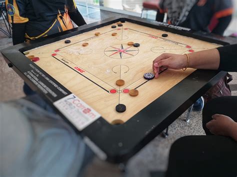 play carrom game   ideal      boredom