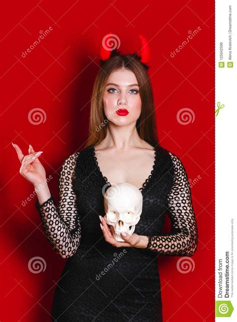 halloween woman devil on red background stock image
