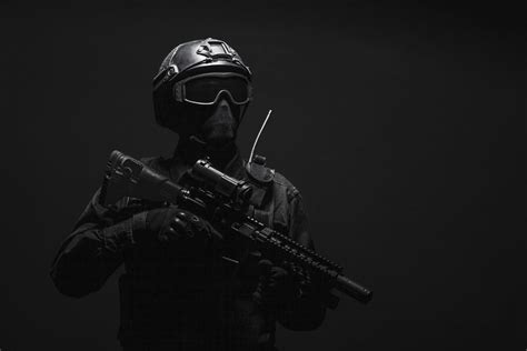 spec ops police officer swat  black uniform  face mask studio shot poster print  oleg