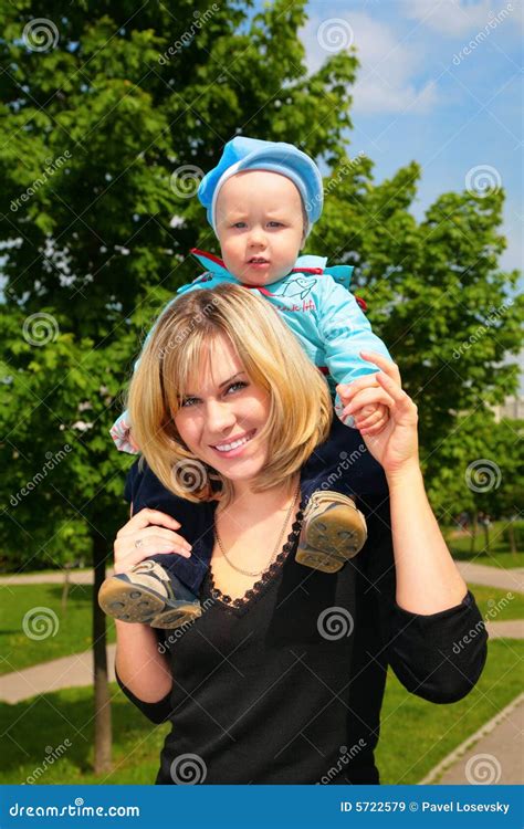 mother hold child  shoulders outdoor stock image image
