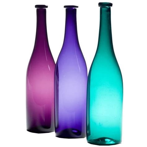 A Group Of Coloured Glass Bottles Colored Glass Bottles