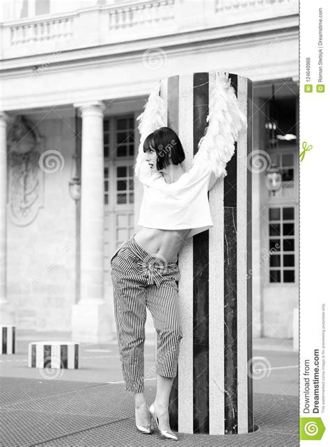 Girl Pose In Paris France Girl In Blouse And Pants At Column Outdoor