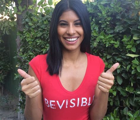 A Woman In A Red Shirt Giving The Thumbs Up