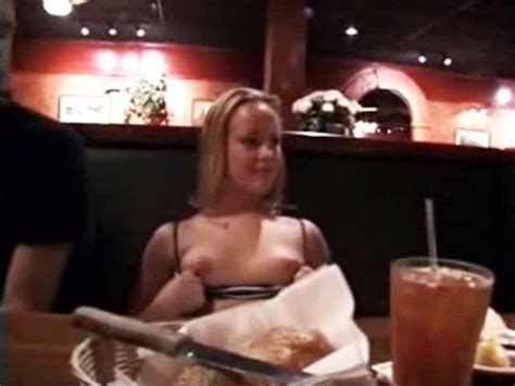 exhibitionist girl shows her tits in the restaurant