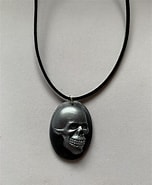 Image result for Shrunken Iksar Skull Necklace. Size: 152 x 185. Source: www.etsy.com