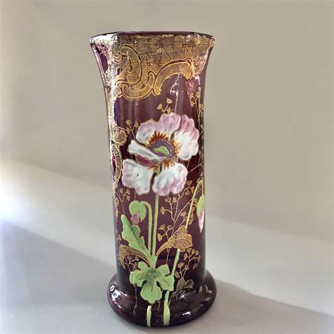 An Amethyst Glass Vase By Legras With Poppies Decorations