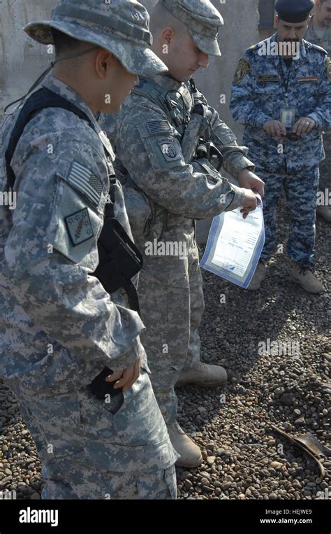 U S Army Sgt Zulfikar Keskin Right Demonstrates How To Place Left