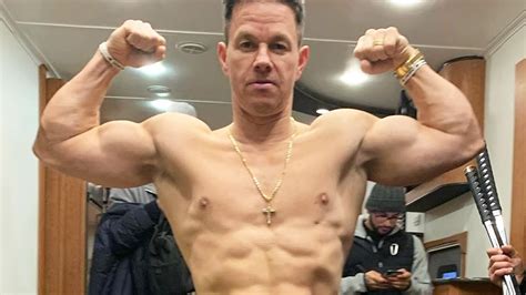 watch access hollywood interview mark wahlberg flexes his bulging