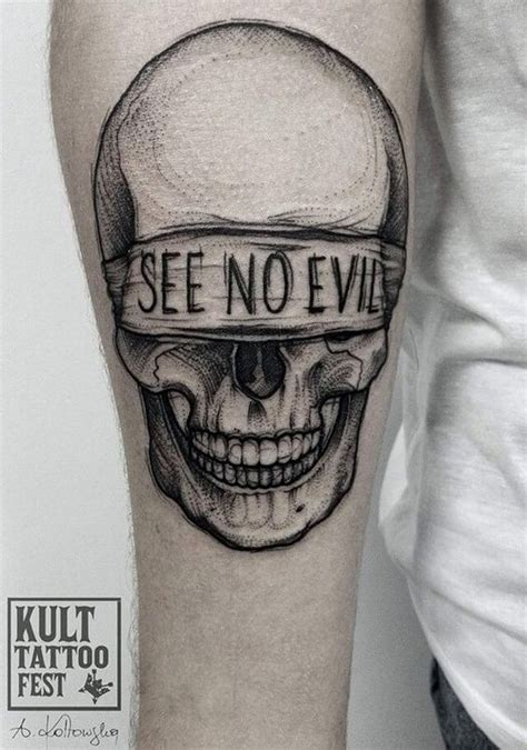 dot style creepy looking arm tattoo of human skull with lettering