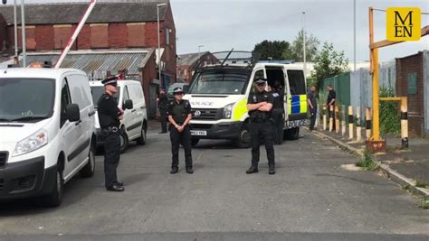 dozens of police raid travellers site in crackdown on crime network
