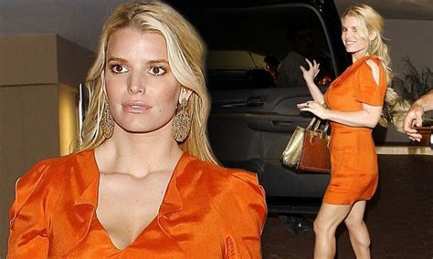 jessica simpson shows off her new found body confidence in a thigh skimming orange minidress for