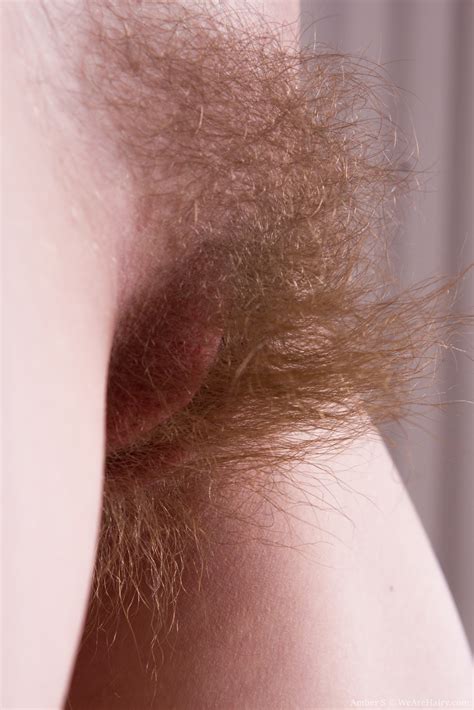 her long and thick pubic hair looks sexy in close up as the teen strips