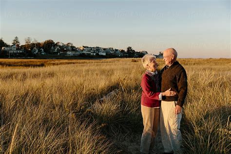 Happy Senior Couple Hugging And Smiling Outdoors Modern Love By