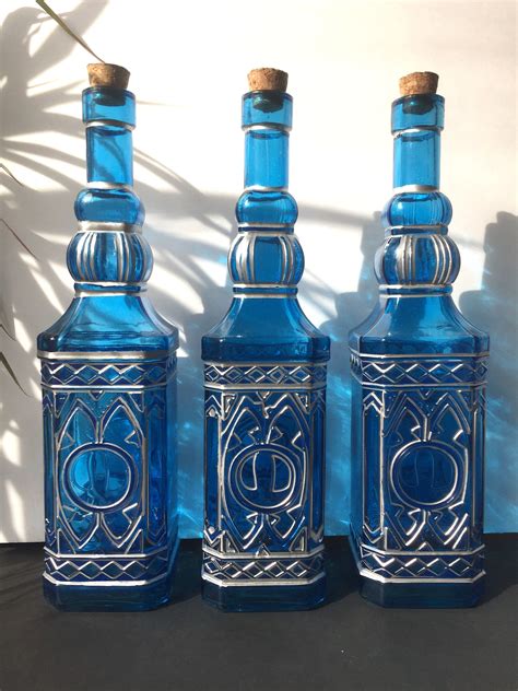 lighted decorative blue glass bottles hand painted metallic silver