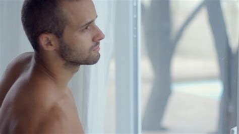naked sexy man looking out the window and drinking by lovevision videohive