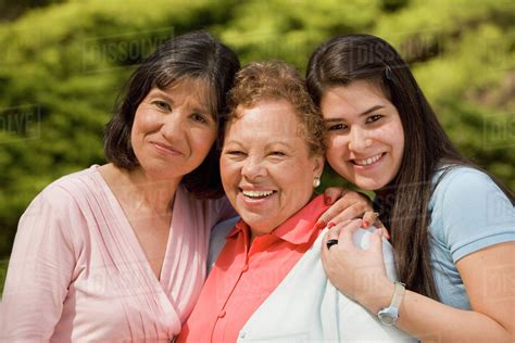 portrait  multi generational hispanic female family members stock photo dissolve