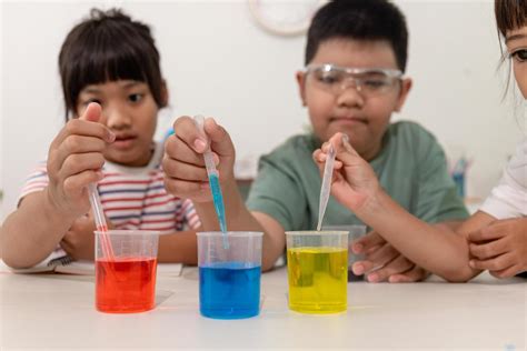 asian kids  chemical experiments   home  stock photo