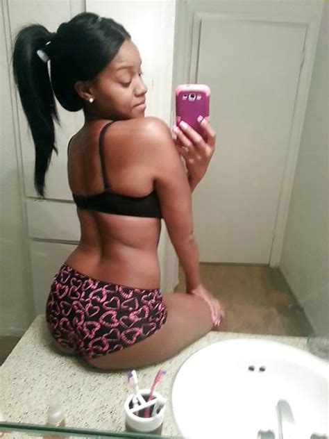 nasty black chick taking selfie in bikini hood tube