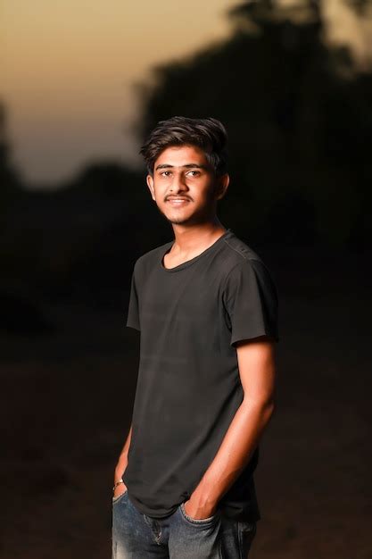 premium photo young handsome indian boy wearing black  shirt