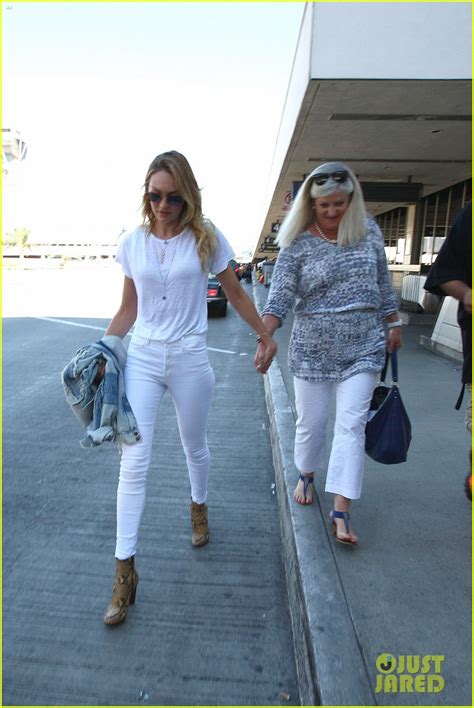 A Candice Swanepoel And Mom Eileen Hold Hands At Lax Airport Photo