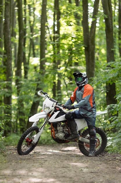 photo front view stylish rider posing  motorbike