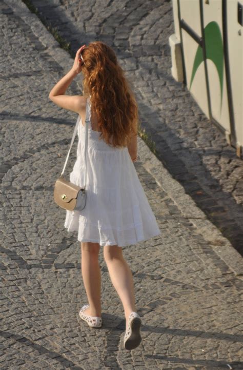 redhead in white dress