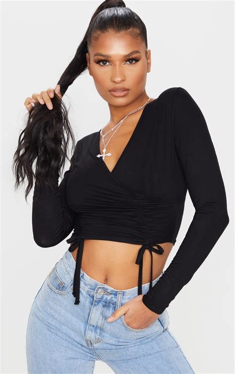 black ruched wrap front long sleeve crop top prettylittlething