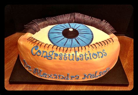 cake decorated   eye  congratulations written  blue