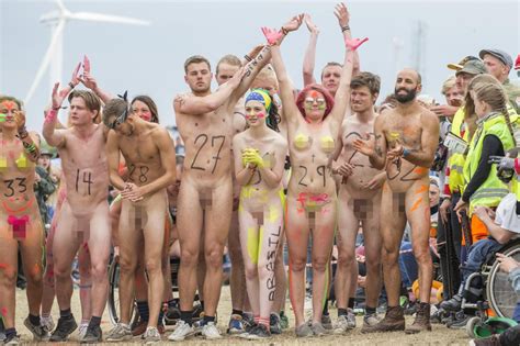 hundreds of naked runners strip off for denmark s annual roskilde festival naked race