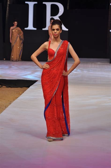 red lace saree with silver border and blue backing and a