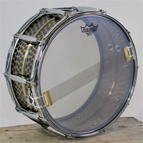 hammered brass snare drum