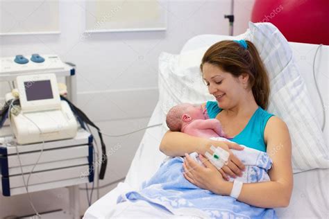 young mother giving birth   baby stock photo  cfamveldman