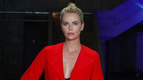 charlize theron looks red hot at atomic blonde event in berlin see her fierce look