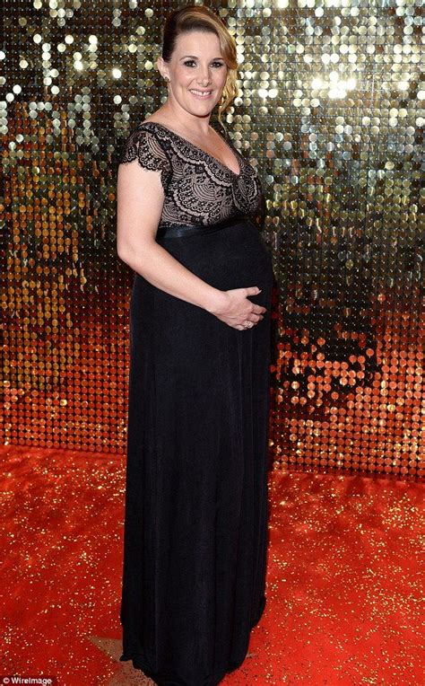 pregnant sam bailey cradles bump in lace maxi dress at soap awards
