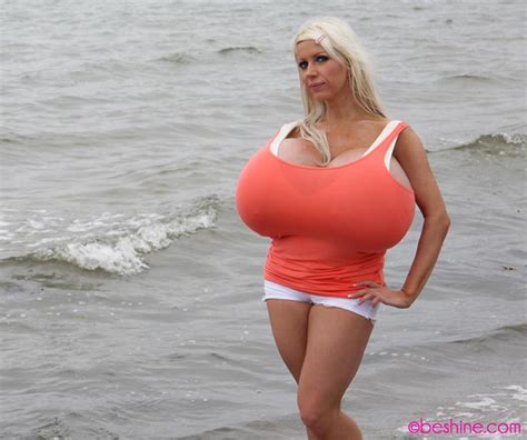 beshine in orange top at the beach the boobs blog