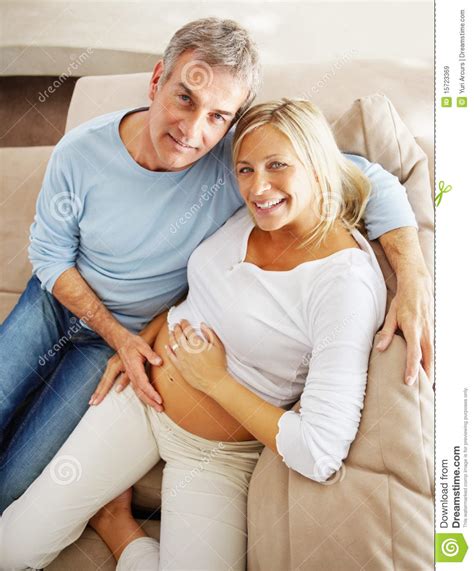 Royalty Free Stock Images Relaxed Mature Man Sitting With His Pregnant