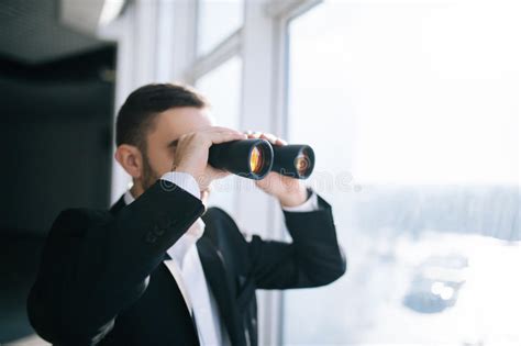 Man With Binoculars Spying On Neighbors Stock Image