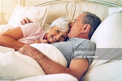 men and women in bed kissing touching bildbanksfoton och bilder getty