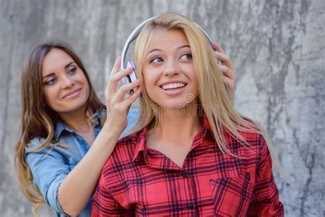 blonde teen girl listening to music stock image image of jeans adult 226577