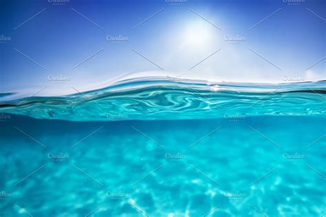 underwater shot clear water  sunny blue sky tropical ocean