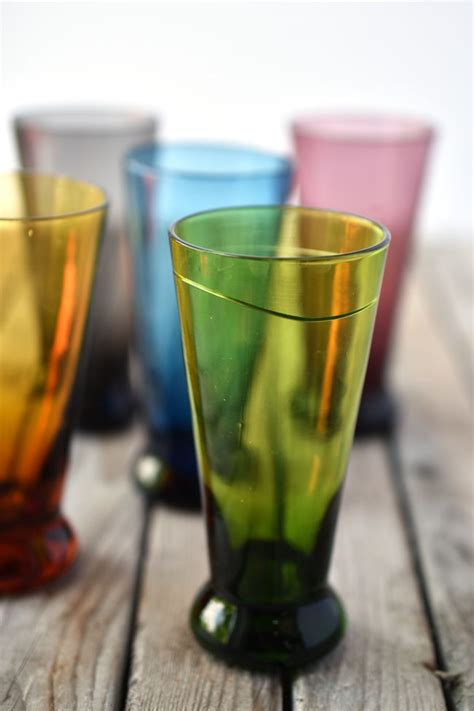woman in real life colourful thrifted drinking glasses and vintage bliss