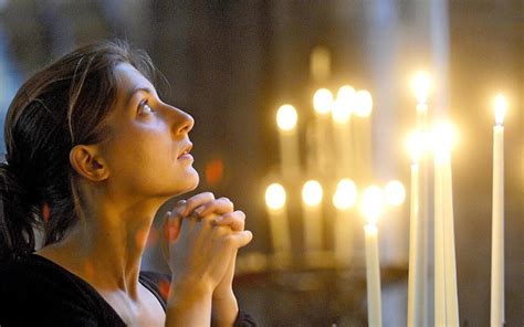 young woman praying  church xlarge wwwimmaculateone