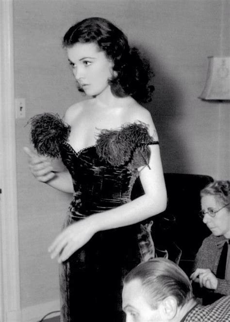 vivien leigh trying the iconic red dress behind the scenes of gone