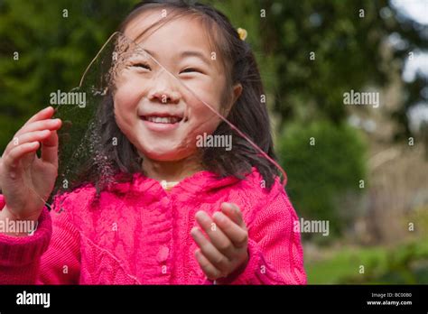 korean girl holding sheet  ice stock photo alamy