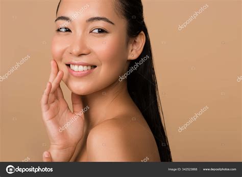 Smiling Beautiful Naked Asian Girl Looking Away Isolated Beige Stock