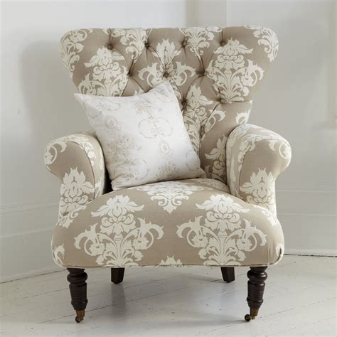 office button  cream patterned armchair