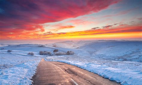 sunset clouds winter road snow hill yellow red