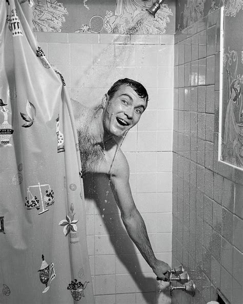 1950s Man In Shower Turning On Water Photograph By Vintage Images Pixels