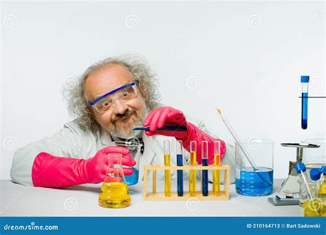 scientist mixing test liquid  tube   reaction lab rat sitting  box royalty