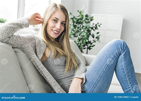 Young Woman On A Sofa On The Living Room Stock Image Image Of Smiling